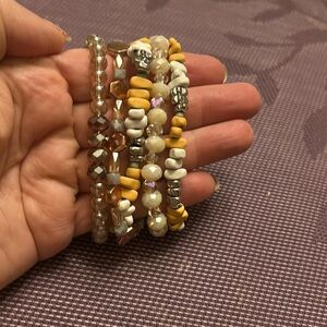 Erimish stack of 5 stretch bracelets. Peach and white